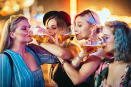 Female,Friends,Drinking,Beer,At,Music,Festival