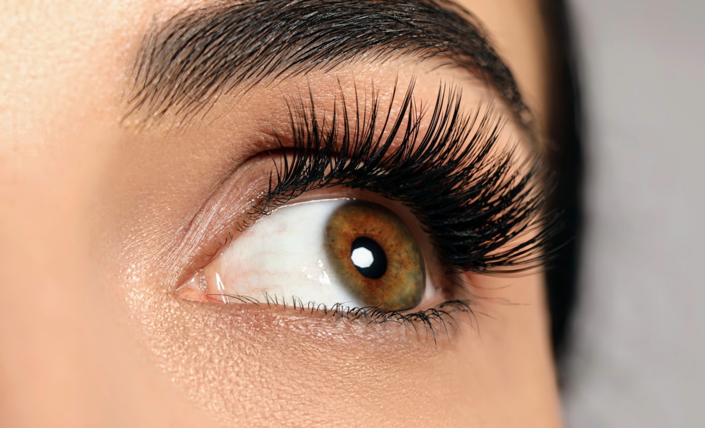 Eyelashes keep vision clear by actively repelling water